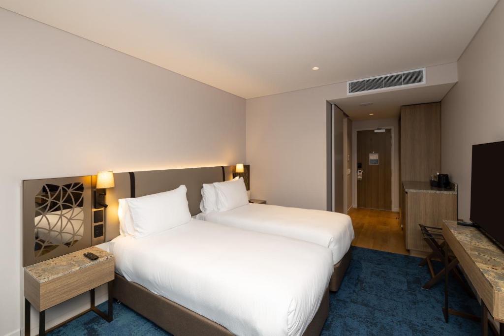 Postel nebo postele na pokoji v ubytování Hotel Grand Chancellor Auckland