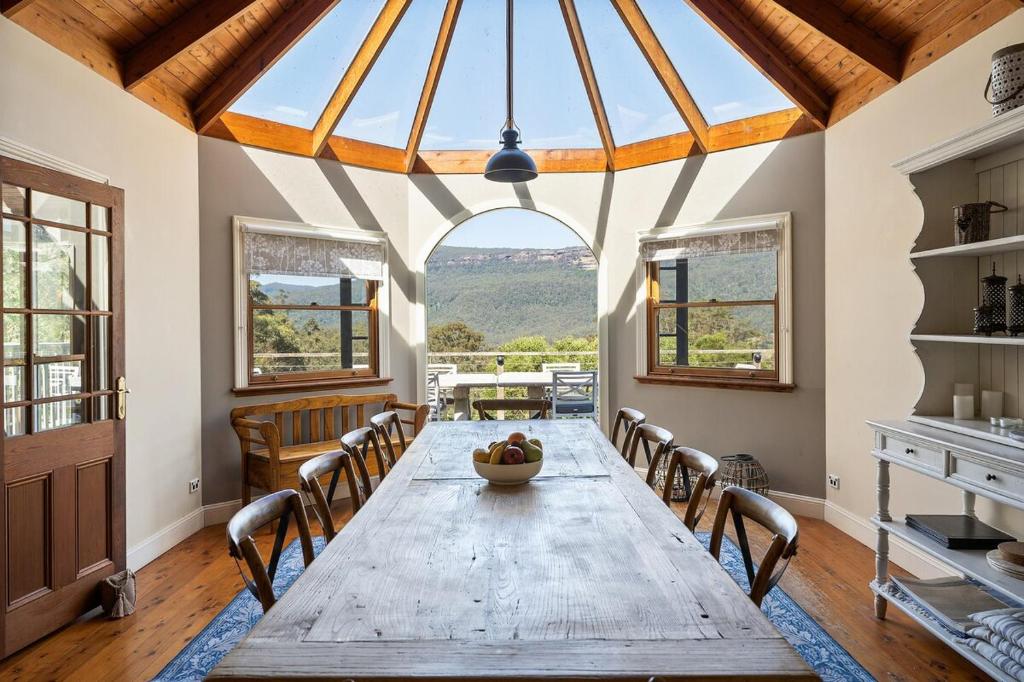a large dining room with a wooden table and chairs at South Haven in Upper Kangaroo River