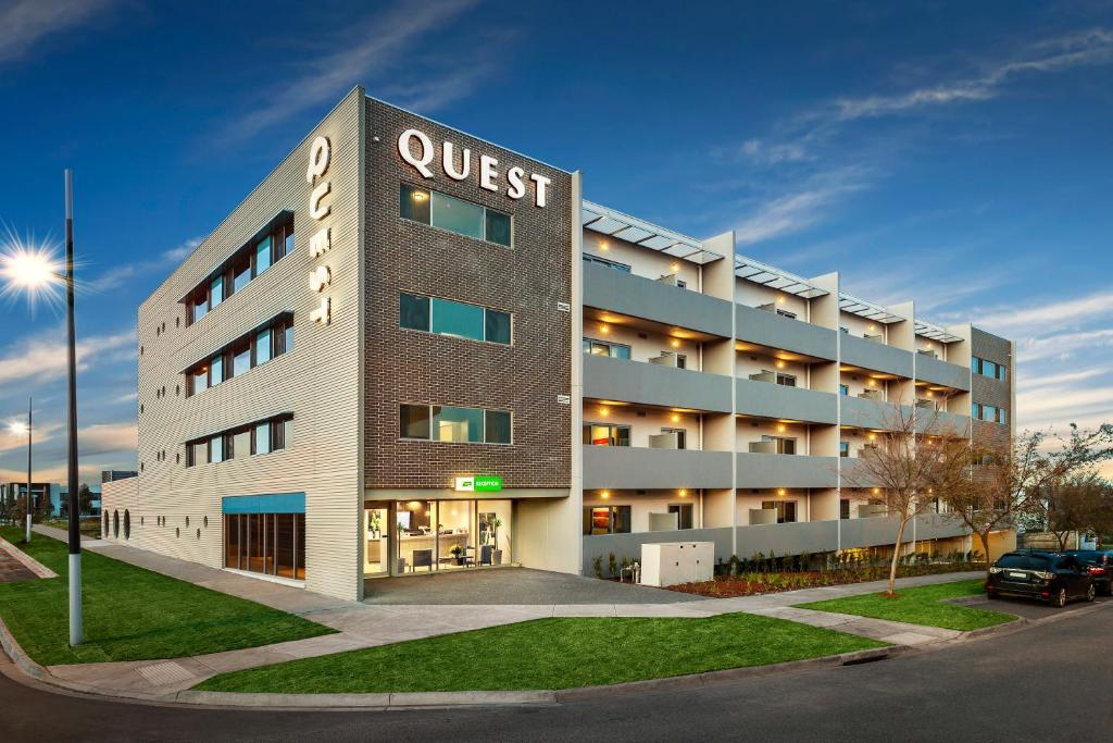 a building with a quest hotel on the side of it at Quest Bundoora in Melbourne