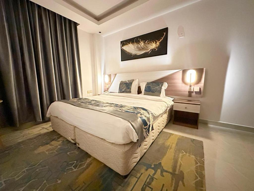 Postel nebo postele na pokoji v ubytování F & H Hotel