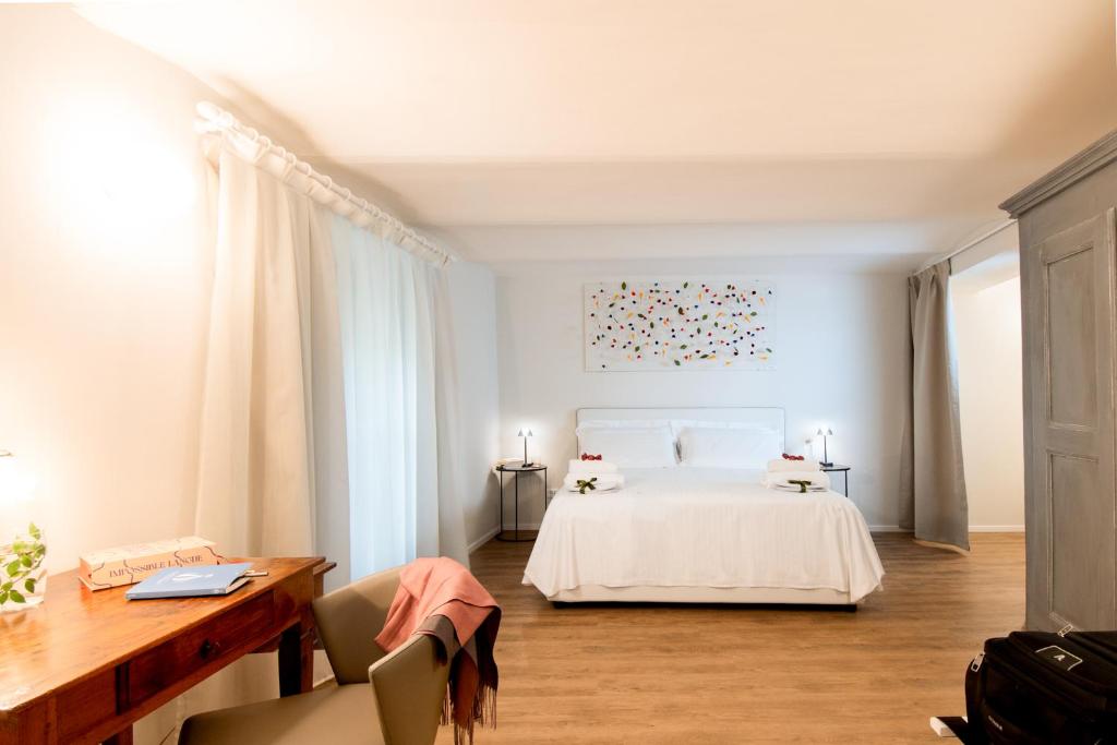 Postel nebo postele na pokoji v ubytování Millefiori Apartment