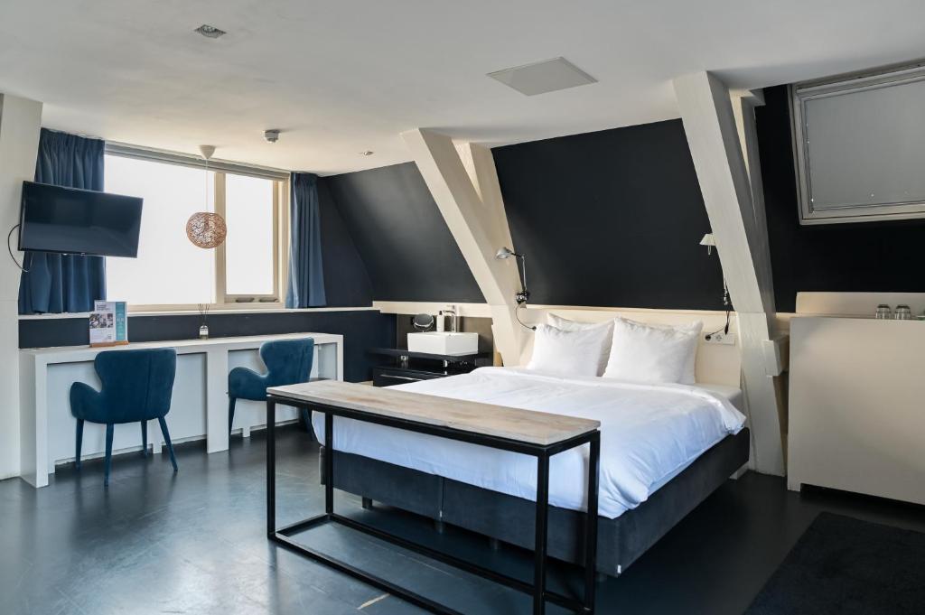 Postel nebo postele na pokoji v ubytování Anne&Max Boutique Hotel