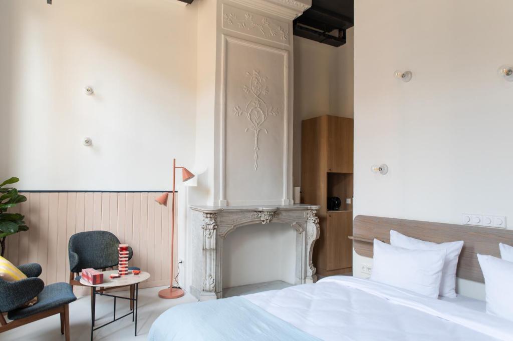Postel nebo postele na pokoji v ubytování Anne&Max Boutique Hotel