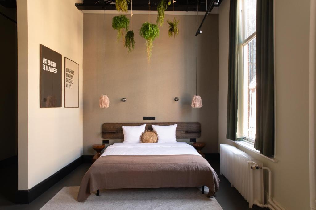 Postel nebo postele na pokoji v ubytování Anne&Max Boutique Hotel