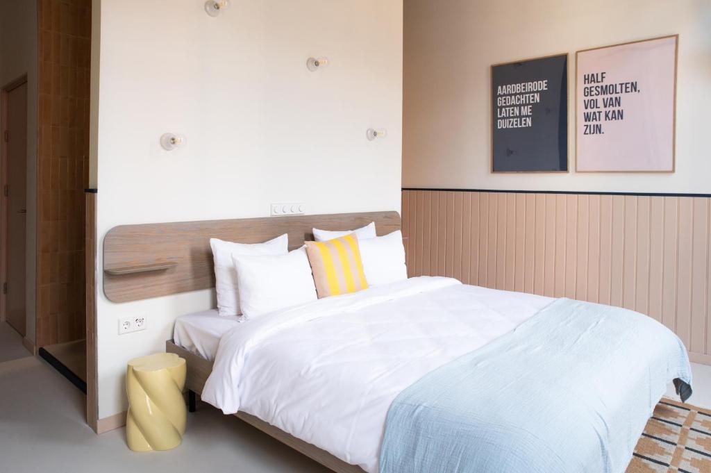Postel nebo postele na pokoji v ubytování Anne&Max Boutique Hotel