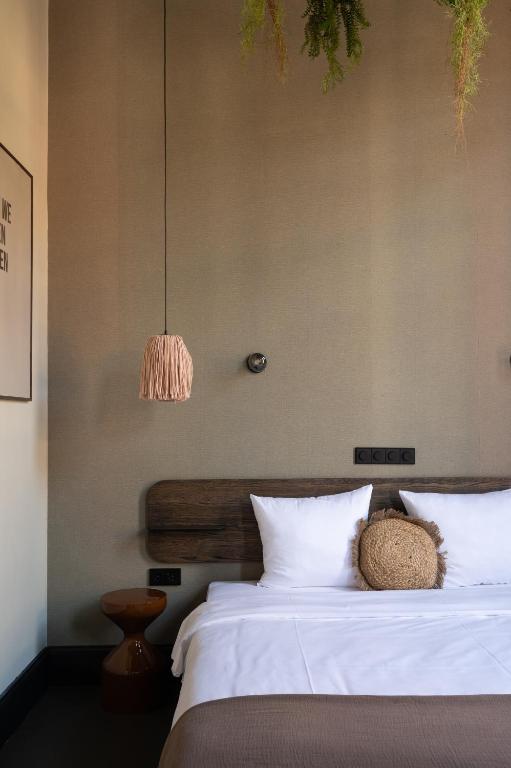 Postel nebo postele na pokoji v ubytování Anne&Max Boutique Hotel