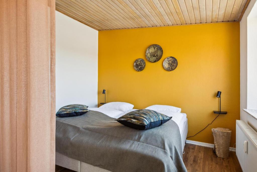 Postel nebo postele na pokoji v ubytování Hotel Ringkøbing