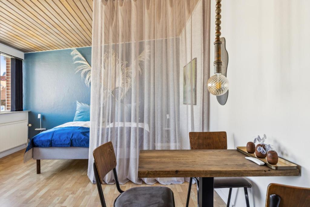 Postel nebo postele na pokoji v ubytování Hotel Ringkøbing
