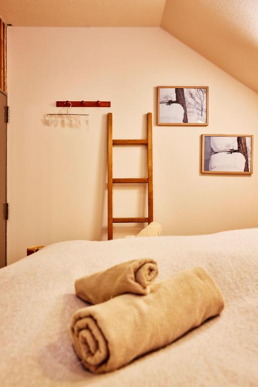 Postel nebo postele na pokoji v ubytování Canopy Lodge - Boutique Lodge at Hakuba Cortina