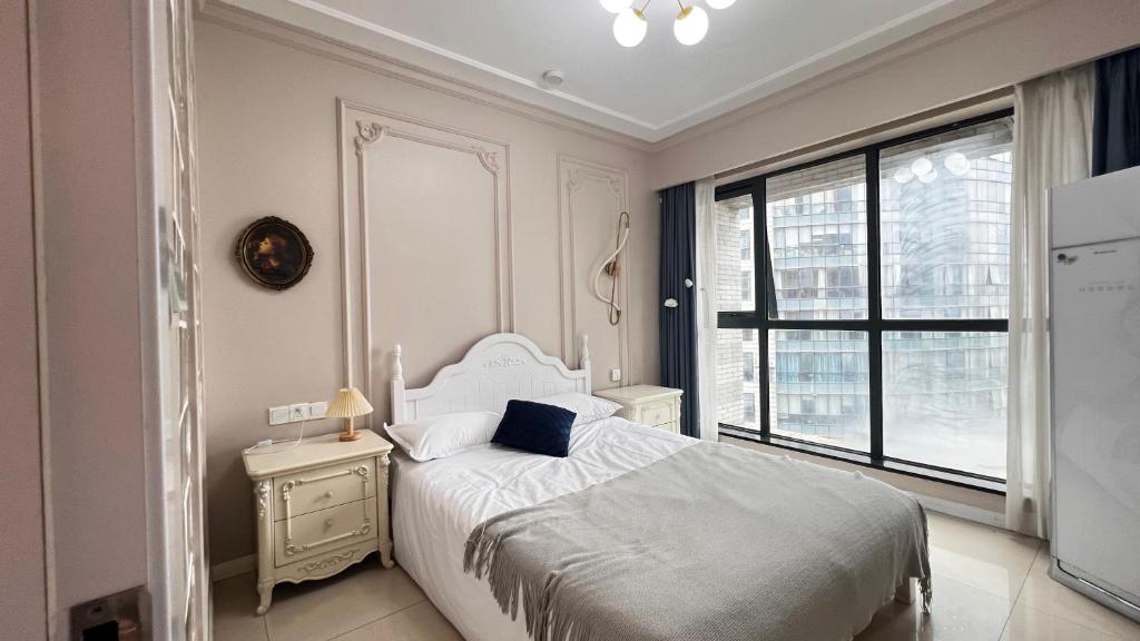 Voodi või voodid majutusasutuse Duowei Executive Apartment Changsha Branch Wuyi Square Branch toas