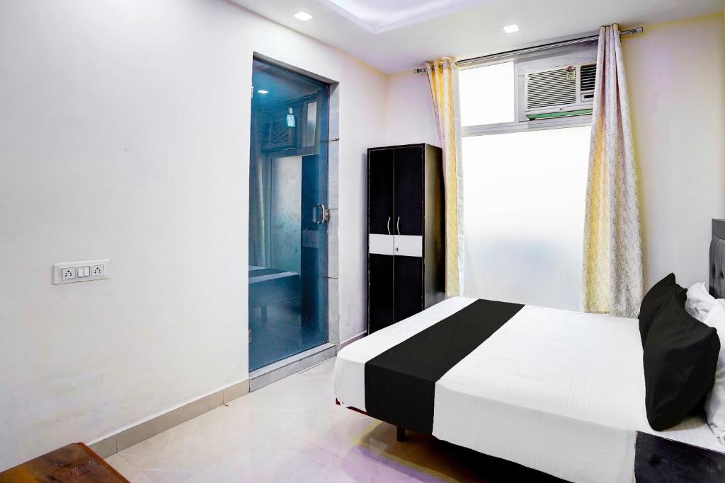 Postel nebo postele na pokoji v ubytování Super Hotel O Varn Residency And Hotels