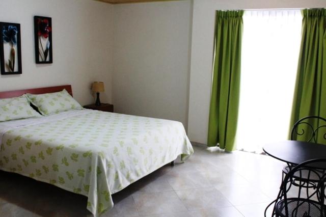 Postel nebo postele na pokoji v ubytování Hoteles Bogotá Inn Park Way