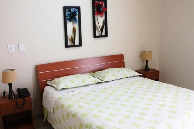 Postel nebo postele na pokoji v ubytování Hoteles Bogotá Inn Park Way