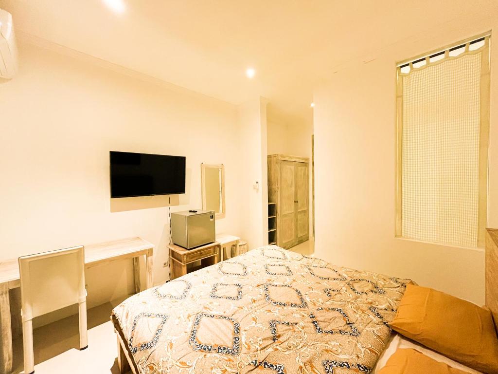 TV a/nebo společenská místnost v ubytování Alita Hotel Sanur