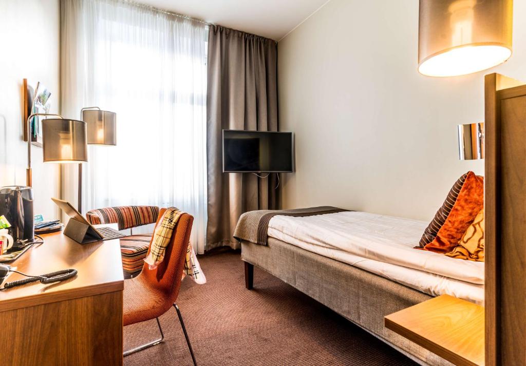 Postel nebo postele na pokoji v ubytování Scandic Stora Hotellet