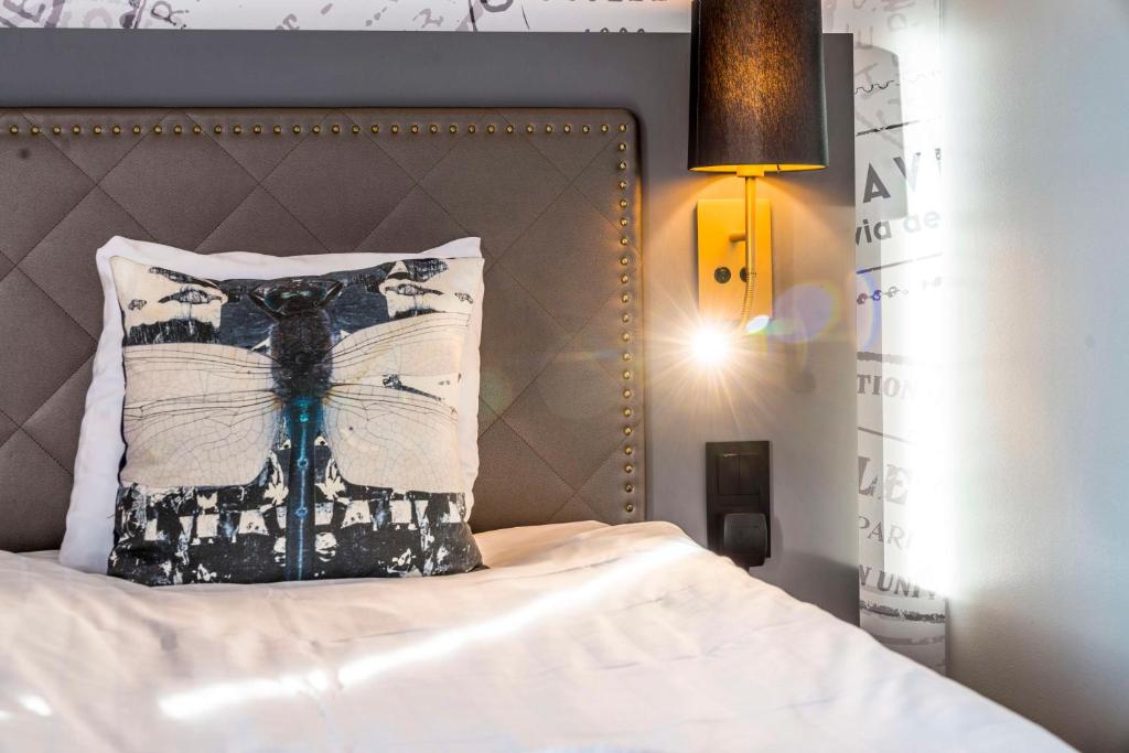 Postel nebo postele na pokoji v ubytování Scandic Stora Hotellet