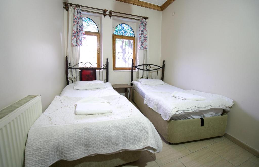 Postel nebo postele na pokoji v ubytování Center cave hostel