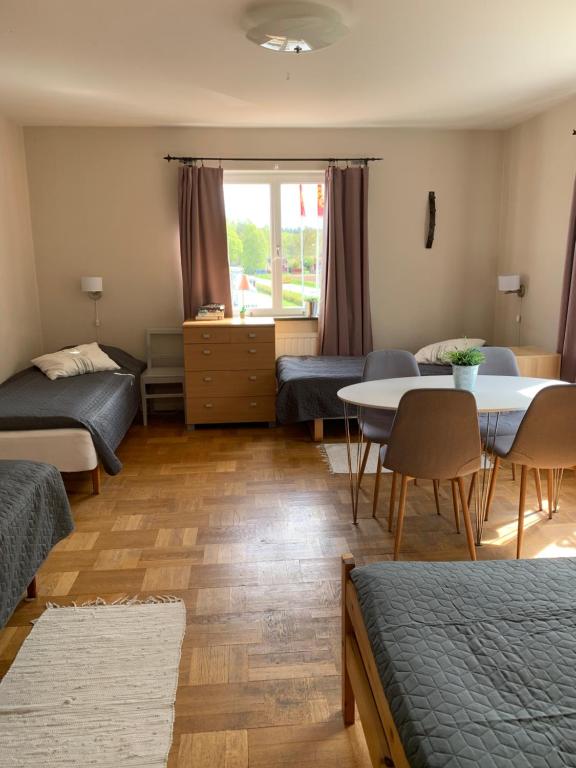Postel nebo postele na pokoji v ubytování Odensvi Vandrarhem