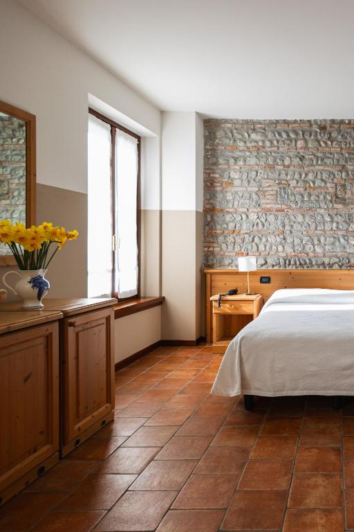 Łóżko lub łóżka w pokoju w obiekcie Agriturismo Mulino Delle Tolle