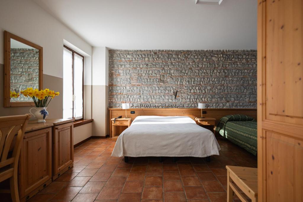 Łóżko lub łóżka w pokoju w obiekcie Agriturismo Mulino Delle Tolle