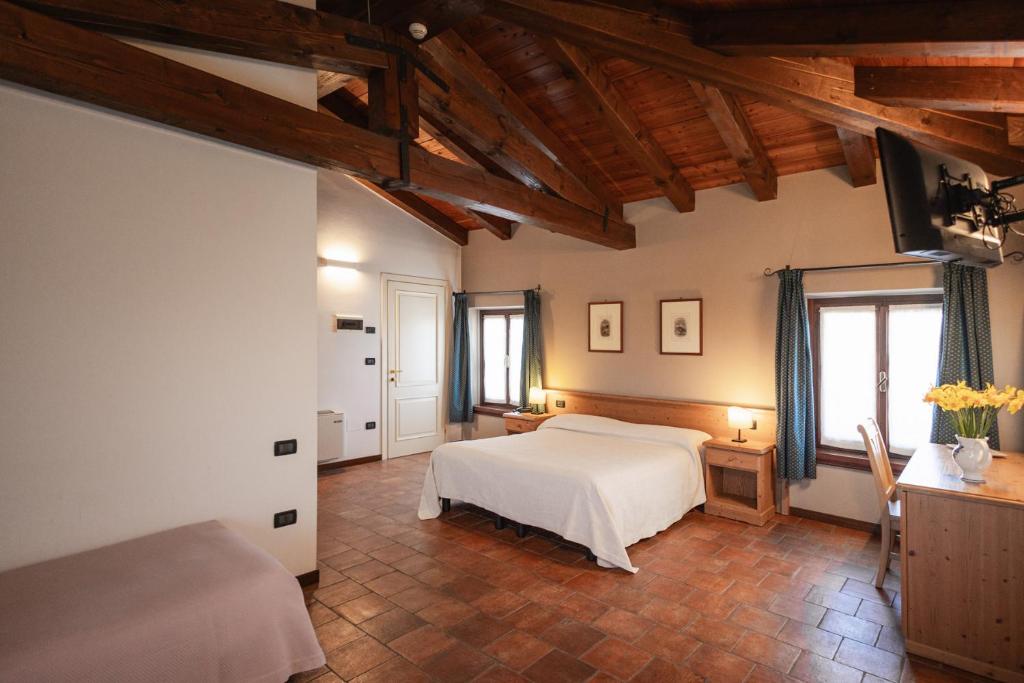 Łóżko lub łóżka w pokoju w obiekcie Agriturismo Mulino Delle Tolle