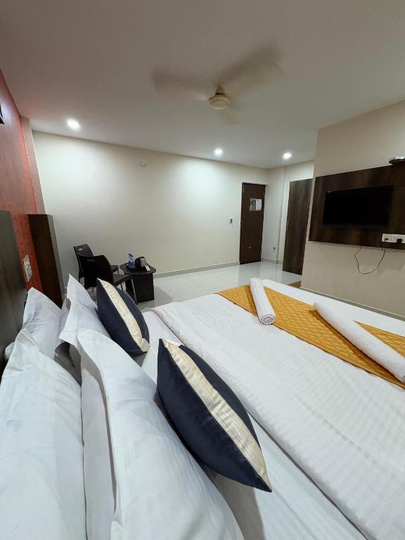 Letto o letti in una camera di Harsha Comforts