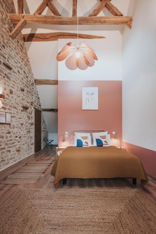 Postel nebo postele na pokoji v ubytování Les Cabottes