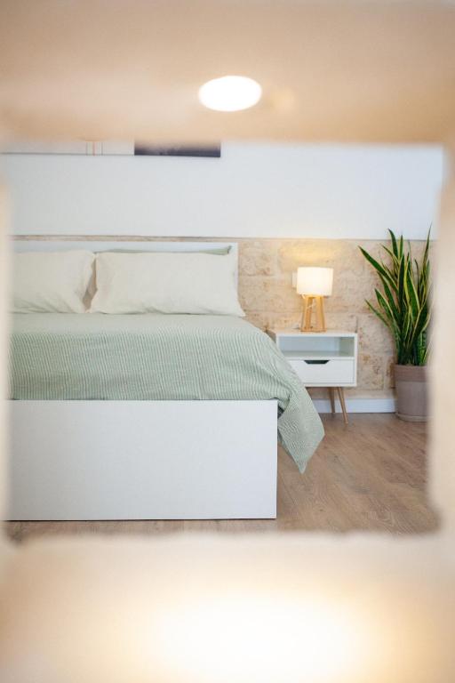 Postel nebo postele na pokoji v ubytování Casa Tonì