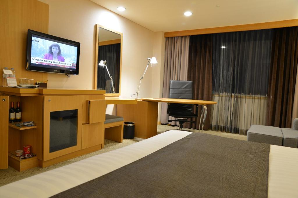 TV a/nebo společenská místnost v ubytování Ramada by Wyndham Songdo