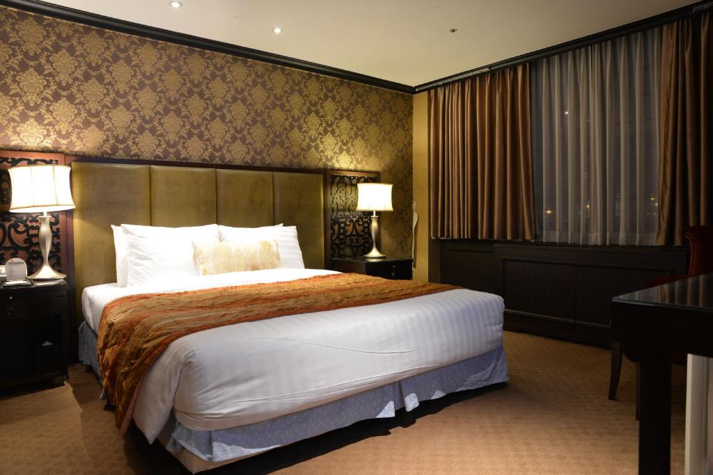 Postel nebo postele na pokoji v ubytování Ramada by Wyndham Songdo