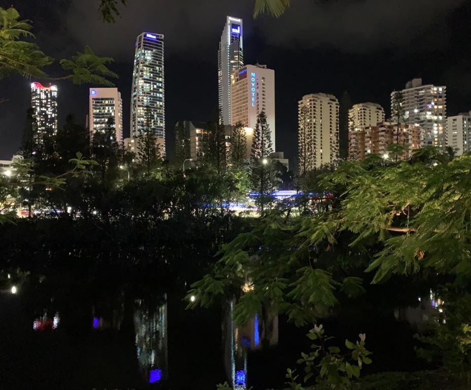 a city skyline at night with tall buildings at Serenity in Surfers Paradise in Gold Coast