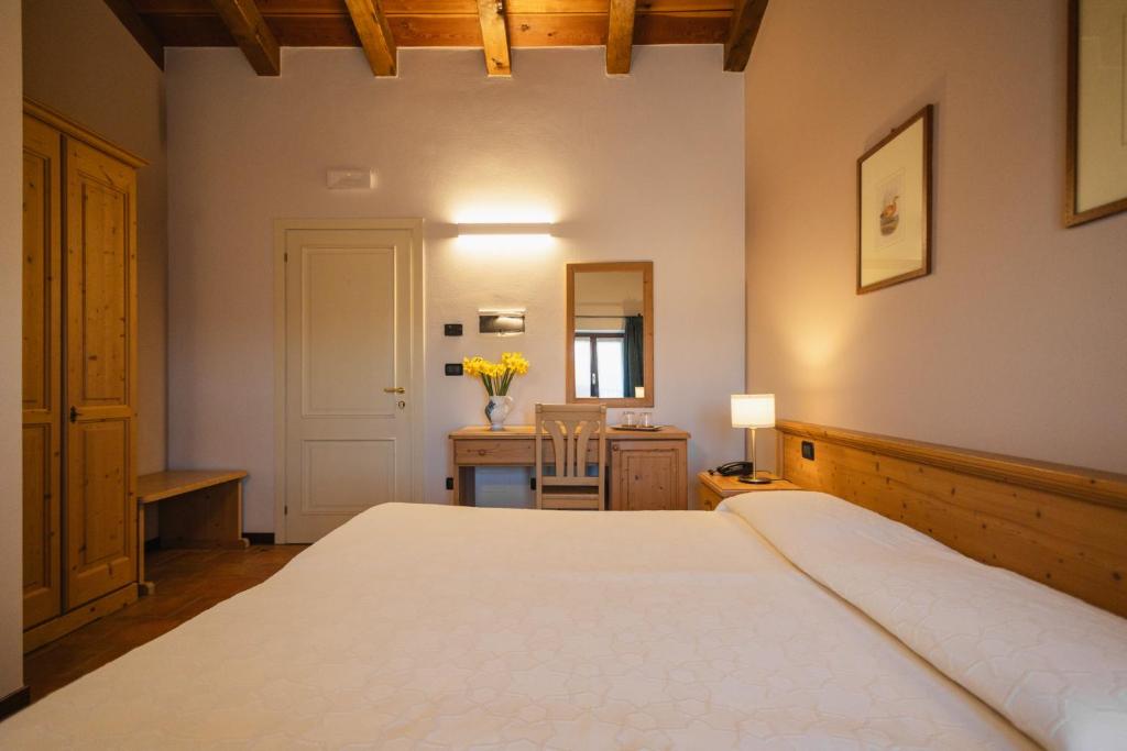 Łóżko lub łóżka w pokoju w obiekcie Agriturismo Mulino Delle Tolle