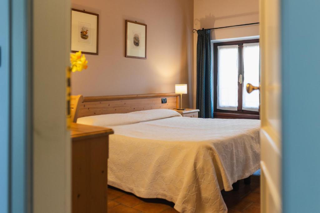 Łóżko lub łóżka w pokoju w obiekcie Agriturismo Mulino Delle Tolle