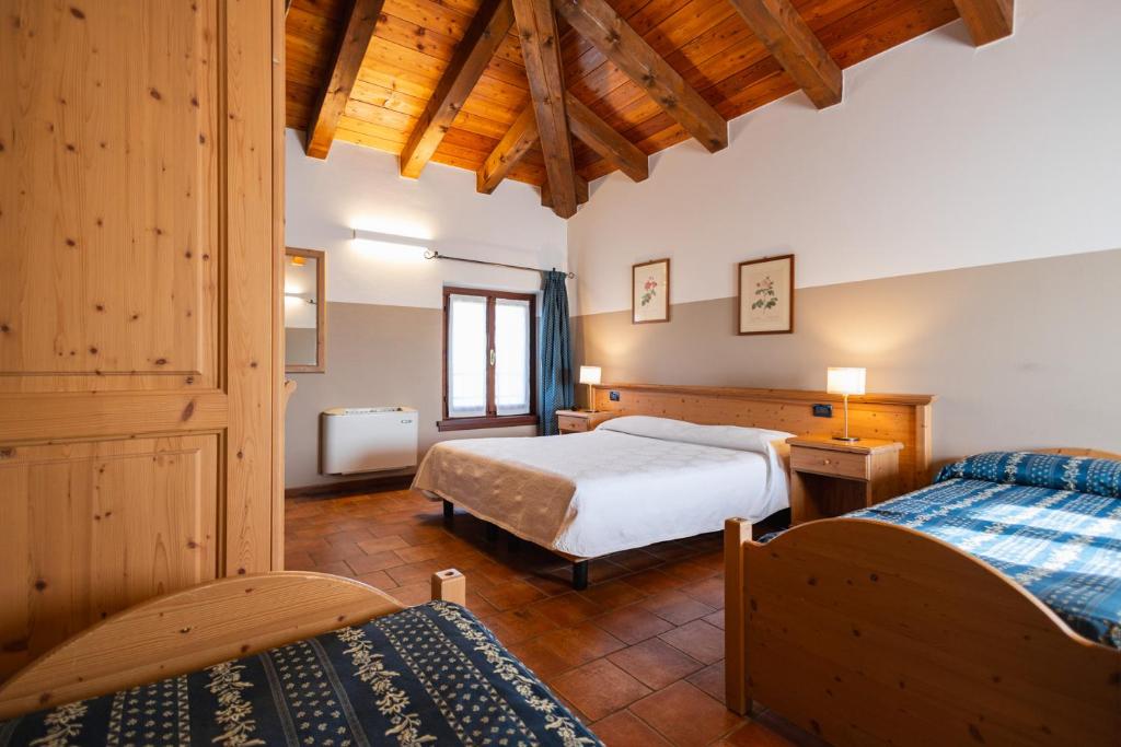 Łóżko lub łóżka w pokoju w obiekcie Agriturismo Mulino Delle Tolle