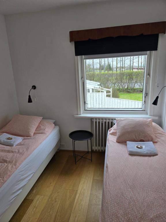 Postel nebo postele na pokoji v ubytování Spói Guesthouse