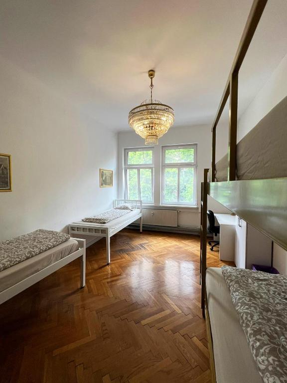Postel nebo postele na pokoji v ubytování Rooms Miklošičeva