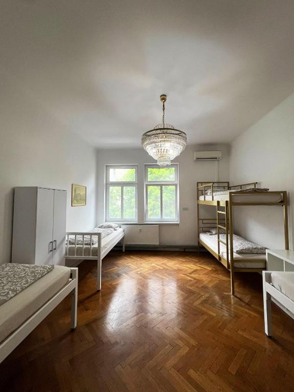 Postel nebo postele na pokoji v ubytování Rooms Miklošičeva