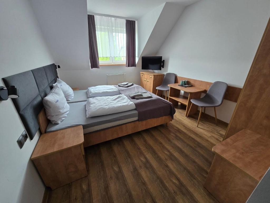 Postel nebo postele na pokoji v ubytování Dom Wczasowy Larix