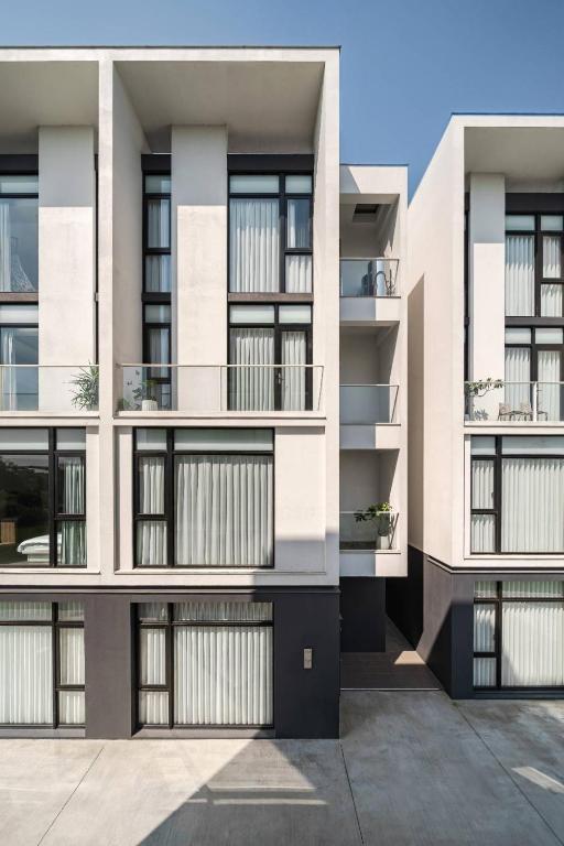 an exterior view of a building with balconies at KK Villa in Dongshan