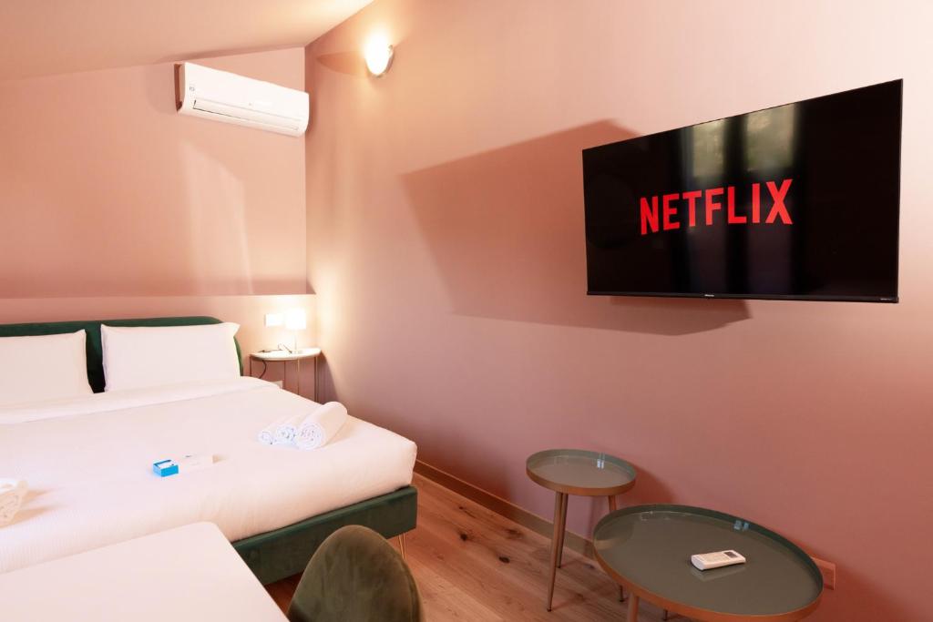 Postel nebo postele na pokoji v ubytování San Giuseppe Suite Lake Como