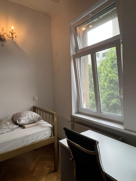 Postel nebo postele na pokoji v ubytování Rooms Miklošičeva