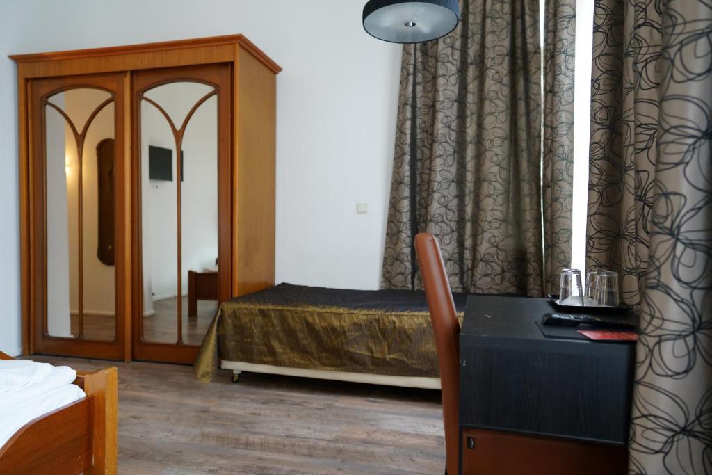 Postel nebo postele na pokoji v ubytování Hotel Xantener Eck