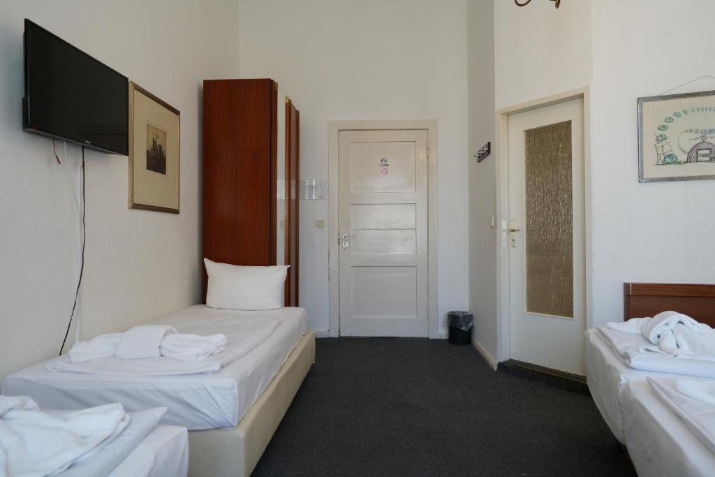 Postel nebo postele na pokoji v ubytování Hotel Xantener Eck