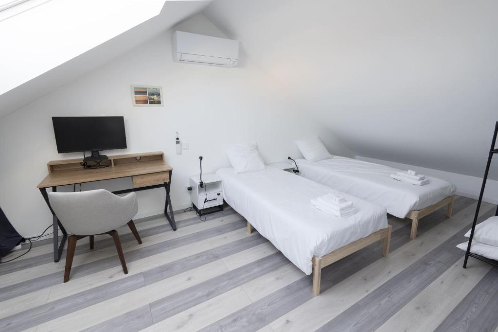 Postel nebo postele na pokoji v ubytování Maison en plein cœur des Sables d'Olonne