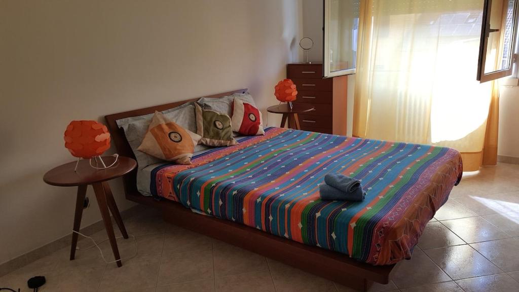 Postel nebo postele na pokoji v ubytování Accogliente appartamento