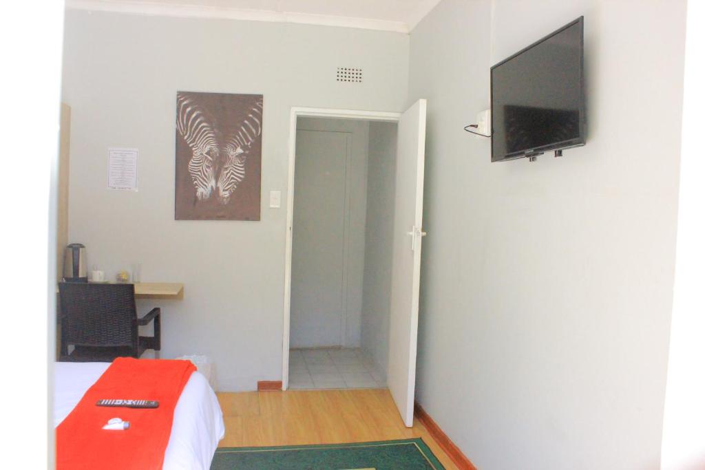 TV o dispositivi per l'intrattenimento presso Fargon Guest House