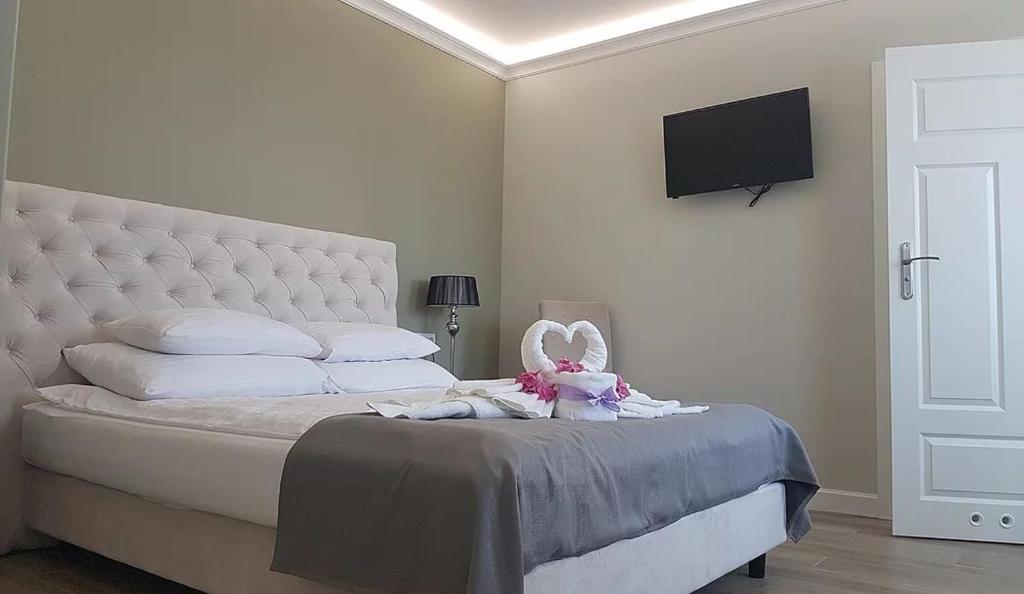 Posteľ alebo postele v izbe v ubytovaní Pokoje Amore Residence