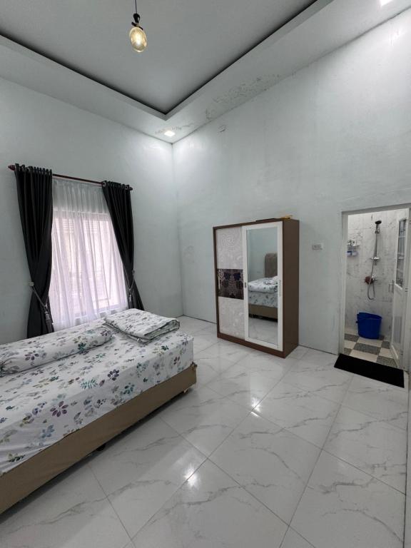 Giường trong phòng chung tại Tropical garden regency N2