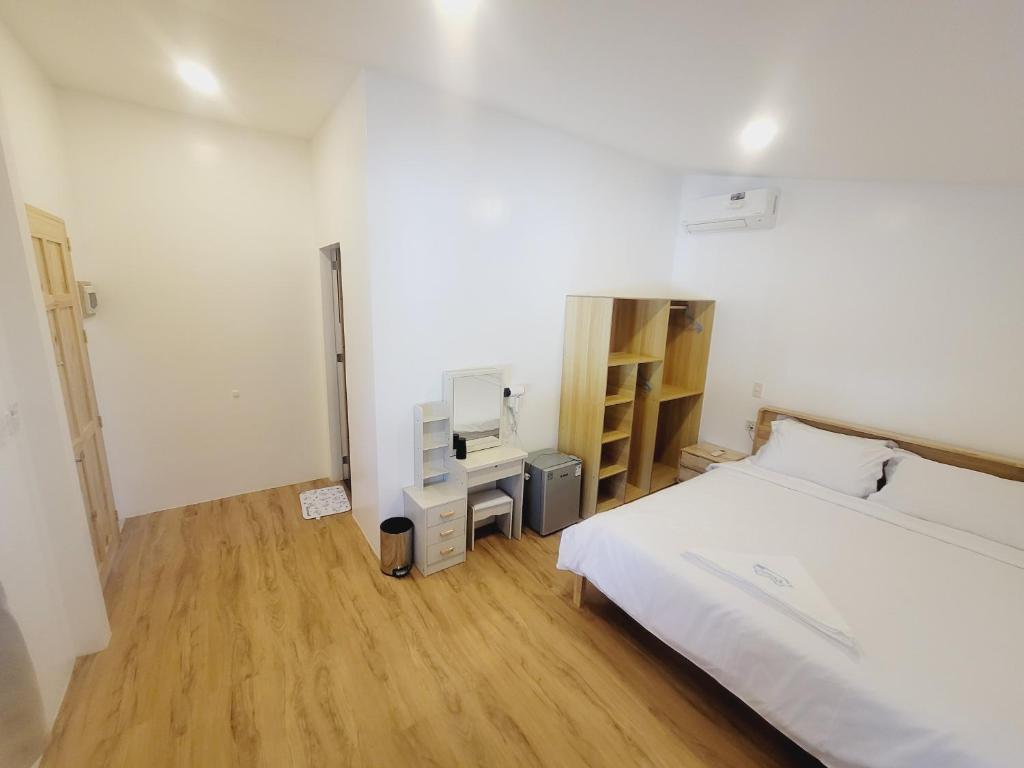 Postel nebo postele na pokoji v ubytování Capsule Hotel in Malapascua