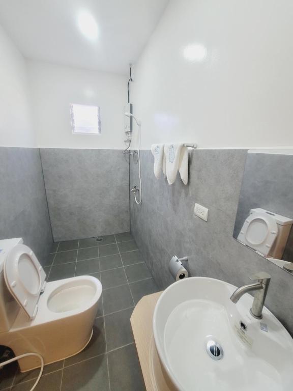 Koupelna v ubytování Capsule Hotel in Malapascua